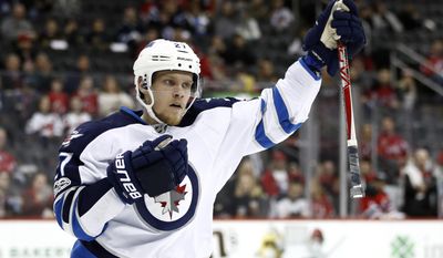 Winnipeg Jets left wing Nikolaj Ehlers, of Denmark, celebrates after scoring a goal on the New Jersey Devils during the first period of an NHL game, Tuesday, March 28, 2017, in Newark, N.J. (AP Photo/Julio Cortez)