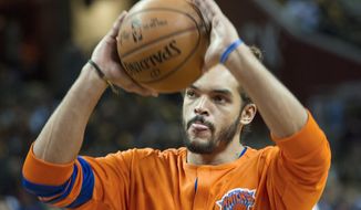 FILE - In this Oct. 25, 2016, file photo, New York Knicks&#39; Joakim Noah warms up before an NBA basketball game against the Cleveland Cavaliers in Cleveland. Noah is expected to return to practice following knee surgery, and the Knicks hope he can begin serving his 20-game suspension for violating the NBA&#39;s anti-drug policy as soon as this week. (AP Photo/Phil Long, File)