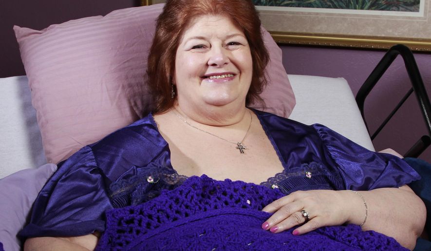 FILE - In this July 20, 2012 file photo, Darlene Cates, poses for picture at her home in Forney, Texas. Cates, who played the housebound mother in the 1993 film "What's Eating Gilbert Grape," died at home in her sleep on Sunday morning, March 26, 2017. (Michael Ainsworth/The Dallas Morning News via AP)