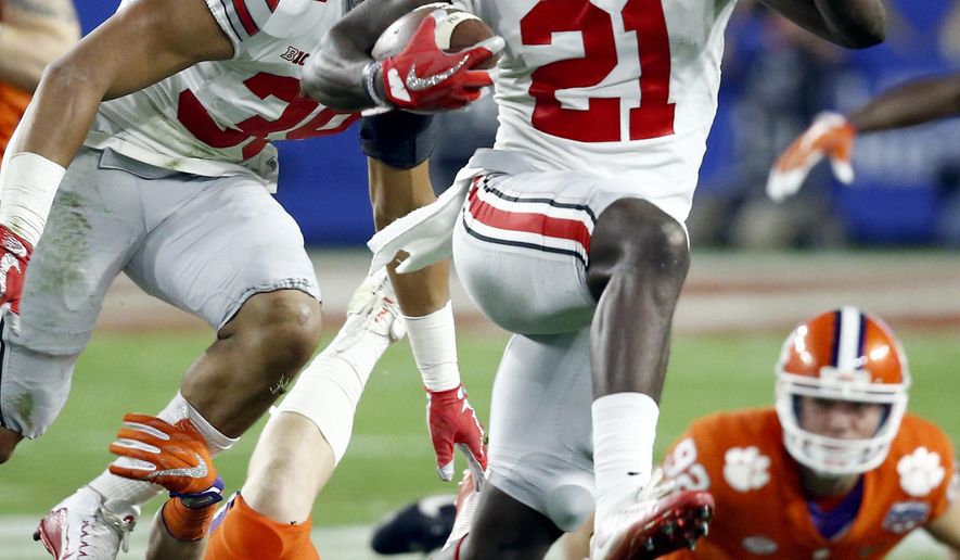 FILE - In this Dec. 31, 2016, file photo, Ohio State wide receiver Parris Campbell (21) escapes the reach of Clemson linebacker Chad Smith (43) during the first half of the Fiesta Bowl NCAA college football playoff semifinal, in Glendale, Ariz. Ohio State coach Urban Meyer said Tuesday that Parris Campbell is distinguishing himself at receiver, and K.J. Hill, Terry McLaurin and Binjimen Victor also are getting noticed as the Buckeyes work to improve their passing game this spring. (AP Photo/Ross D. Franklin, File)