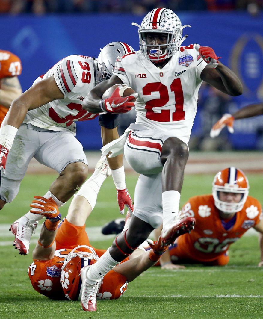 FILE - In this Dec. 31, 2016, file photo, Ohio State wide receiver Parris Campbell (21) escapes the reach of Clemson linebacker Chad Smith (43) during the first half of the Fiesta Bowl NCAA college football playoff semifinal, in Glendale, Ariz. Ohio State coach Urban Meyer said Tuesday that Parris Campbell is distinguishing himself at receiver, and K.J. Hill, Terry McLaurin and Binjimen Victor also are getting noticed as the Buckeyes work to improve their passing game this spring. (AP Photo/Ross D. Franklin, File)