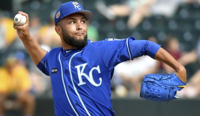 Kansas City Royals relief pitcher Kelvin Herrera throws in the eighth inning of a spring training baseball game against the Oakland Athletics, Monday, March 27, 2017, in Mesa, Ariz. (John Sleezer/The Kansas City Star via AP)
