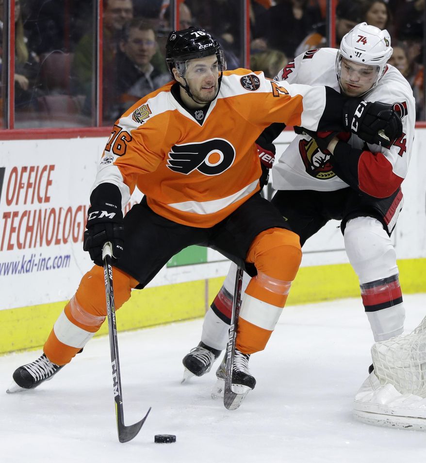 Philadelphia Flyers' Chris VandeVelde, left, tries to keep Ottawa Senators' Mark Borowiecki away during the second period of an NHL hockey game, Tuesday, March 28, 2017, in Philadelphia. (AP Photo/Matt Slocum)