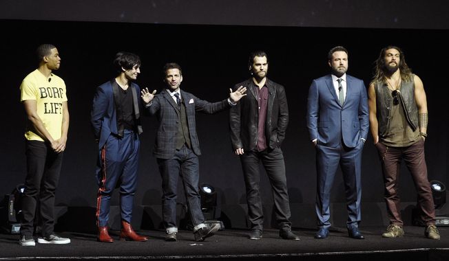 Zack Snyder, center, director of the upcoming film &amp;quot;Justice League,&amp;quot; addresses the audience with cast members, from left, Ray Fisher, Ezra Miller, Henry Cavill, Ben Affleck and Jason Momoa during the Warner Bros. Pictures presentation at CinemaCon 2017 at Caesars Palace on Wednesday, March 29, 2017, in Las Vegas. (Photo by Chris Pizzello/Invision/AP)