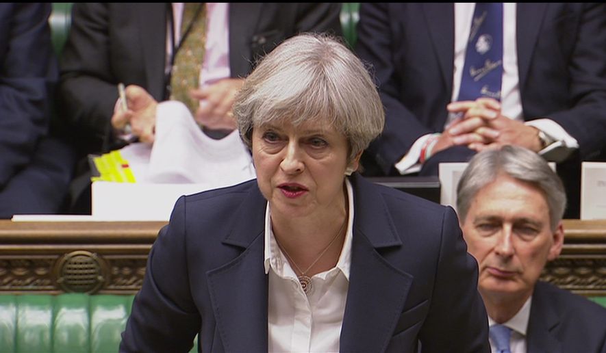 Britain&#39;s Prime Minister Theresa May speaks in the House of Commons in London  in this image taken from video  Wednesday March 29, 2017. May will announce to Parliament that Britain is set to formally file for divorce from the European Union Wednesday, ending a 44-year relationship, enacting the decision made by U.K. voters in a referendum nine months ago and launching both Britain and the bloc into uncharted territory.  (Parliamentary Recording Unit  via AP)