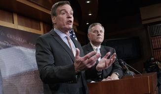 Senate Intelligence Committee Vice Chairman Sen. Mark Warner, D-Va., left, with Committee Chairman Sen. Richard Burr, R-N.C., speaks during a news conference on Capitol Hill in Washington, Wednesday, March 29, 2017, to discuss their panel&#x27;s investigation of Russian interference in the 2016 election. (AP Photo/J. Scott Applewhite)