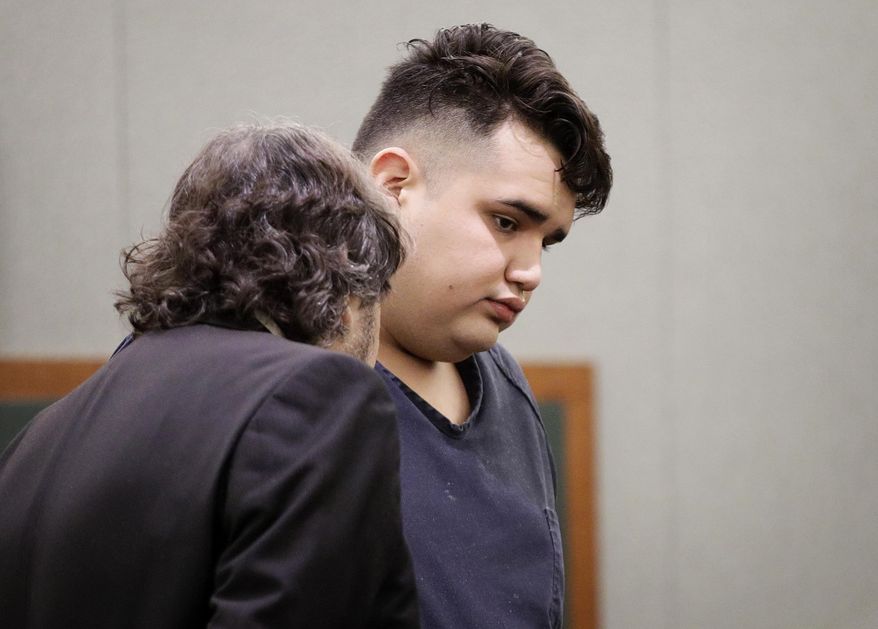 Sebastian Gonzalez, right, appears in court, Wednesday, March 29, 2017, in Las Vegas. Gonzalez is accused of a smash-and-grab burglary at a luxury watch and jewelry store last weekend at a Las Vegas Strip resort. (AP Photo/John Locher)