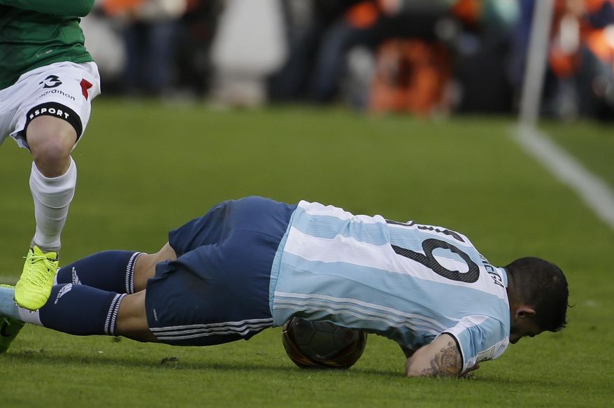 Argentina's Ever Banega falls during a 2018 World Cup qualifying soccer match against Bolivia in La Paz, Bolivia, on Tuesday, March 28, 2017. (AP Photo/Victor R. Caivano)