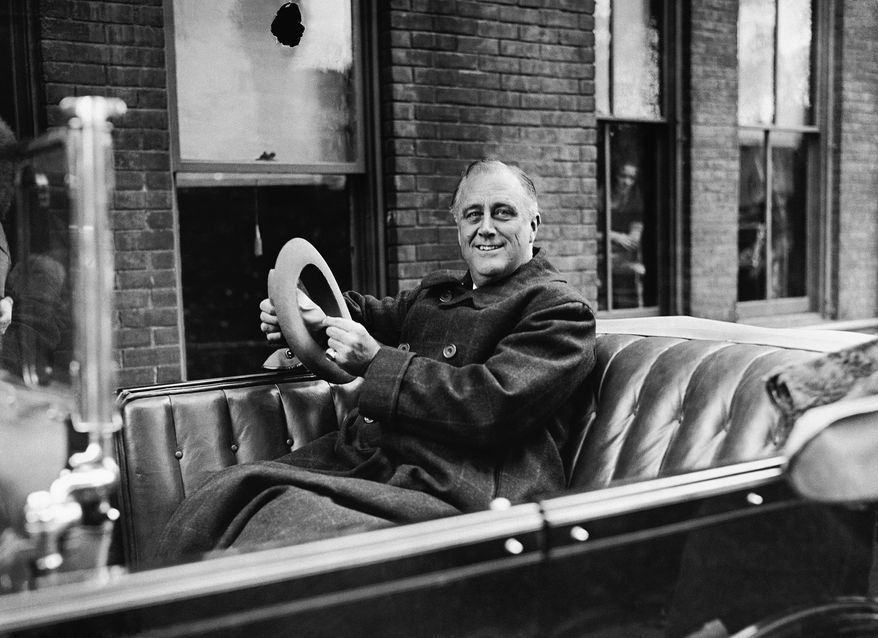 In this Oct. 29, 1932 file photo, New York Gov. Franklin D. Roosevelt is driven in a Packard Phaeton in Albany, NY. Used by FDR from 1929 until his election as president in November 1932, and occasionally after that, the car is headed off to an antique vehicle expert in Connecticut for some repairs. New York Gov. Andrew Cuomo, who plans to use the car for ceremonial occasions, says the repairs will not alter the paint, wheels or upholstery, and will instead focus on basic preservation. (AP Photo/File)