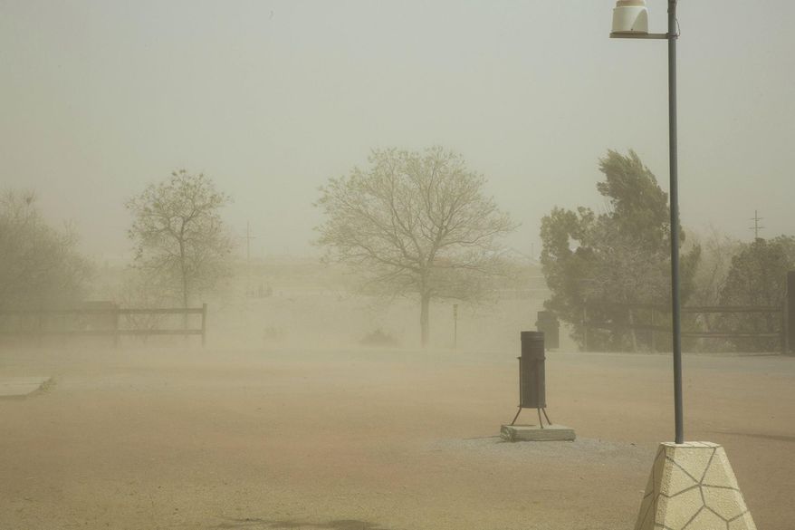 This photo taken March 23, 2017, shows sustained 43 mile per hour winds with 58 mile per hour gusts picked up dust obscuring both the Organ Mountains and A Mountain from view at the New Mexico Farm and Ranch Heritage Museum in Las Cruces, N.M. Not unlike a flash mob gathering in a public place to briefly capture the attention of unsuspecting passers-by, the ingredients in this case — warm temperatures and a lack of rain — came together quickly in New Mexico. It’s called a flash drought. (Josh Bachman /The Las Cruces Sun-News via AP)