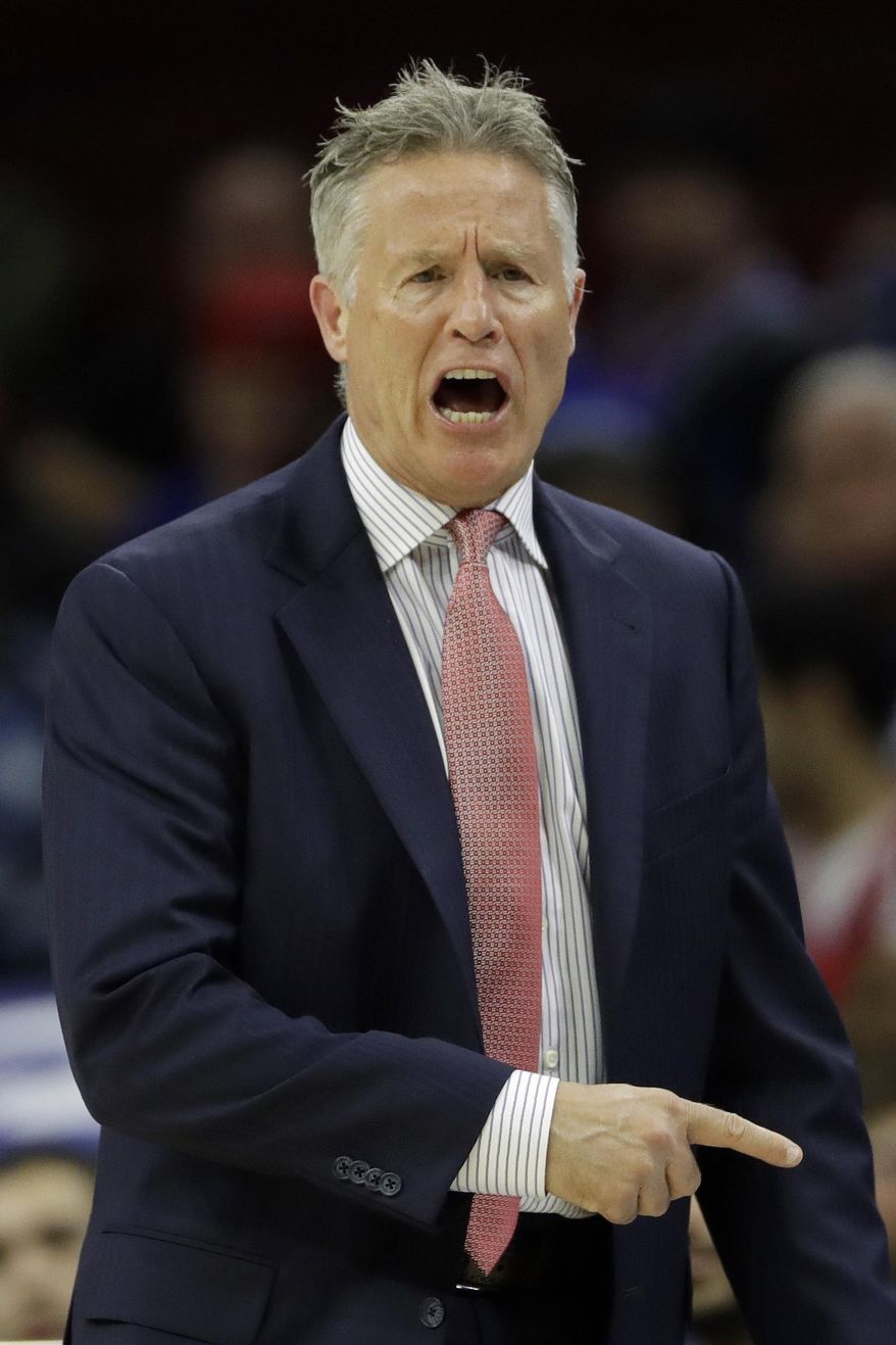 Philadelphia 76ers head coach Brett Brown yells to his team during the first half of an NBA basketball game against the Atlanta Hawks, Wednesday, March 29, 2017, in Philadelphia. (AP Photo/Matt Slocum)