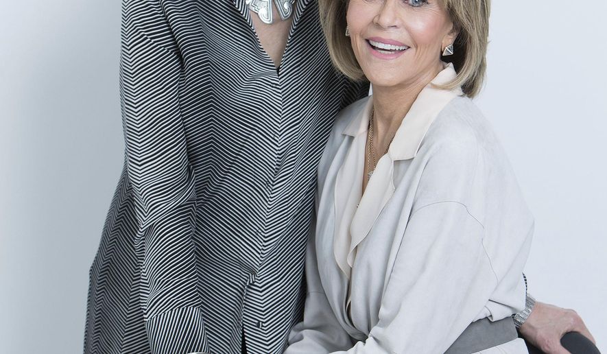 In this March 24, 2017 photo, Lily Tomlin, left, and Jane Fonda, co-stars in "Grace and Frankie," pose for a portrait in New York. The third season of the comedy series is currently streaming on Netflix. (Photo by Amy Sussman/Invision/AP)
