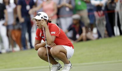 FILE - In this March 5, 2017, file photo, Lydia Kok, of New Zealand, checks her lines on the 11th hole during the HSBC Women&#39;s Champions golf tournament held at Sentosa Golf Club&#39;s Tanjong course in Singapore. The world&#39;s No. 1-ranked player hopes to get back on a winning roll when she returns to the ANA Inspiration this week. (AP Photo/Wong Maye-E, File)
