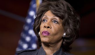 Rep. Maxine Waters, D-Calif., listens during a news conference on Capitol in Washington, in this Feb. 28, 2013, file photo. (AP Photo/J. Scott Applewhite, File)