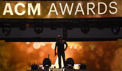 FILE - In this April 19, 2015 file photo, Jason Aldean performs at the 50th annual Academy of Country Music Awards at AT&amp;amp;T Stadium in Arlington, Texas.   The ACM Awards, airing Sunday, April 2, 2017 on CBS  are relying on two likable co-hosts, tried and true stars of the format, cross-genre collaborations, a party vibe and new music to keep fans tuned in.(Photo by Chris Pizzello/Invision/AP)