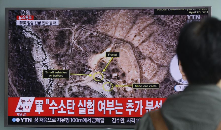 FILE - In this Sept. 9, 2016 file photo, a man watches a TV news program reporting North Korea's nuclear test at Seoul Railway Station in Seoul, South Korea. North Korea has conducted five nuclear tests, the first in 2006. All were conducted in the depths of Mount Mantap, a nondescript granite peak in the remote and heavily forested Hamgyong mountain range about 80 kilometers (50 miles) as the crow flies from Chongjin, the nearest big city. Since North Korea is the only country in the world that still conducts nuclear weapons tests, its Punggye-ri site on - or mostly under - Mount Mantap is also the world’s only active nuclear testing site. The letters on the screen read: "Hydrogen bomb test." (AP Photo/Ahn Young-joon, File)