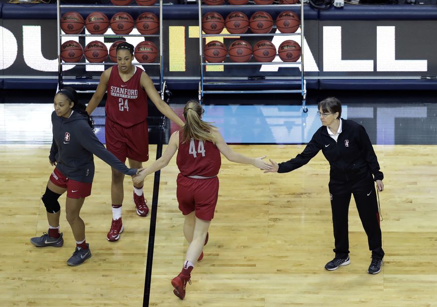 Stanford head coach Tara Vanderveer, right, works with her players during practice at the women's NCAA Final Four college basketball tournament, Thursday, March 30, 2017, in Dallas. (AP Photo/Eric Gay)