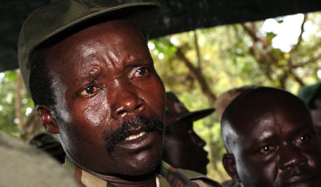 FILE - In this Nov. 12, 2006 file photo, the leader of the Lord&#x27;s Resistance Army, Joseph Kony answers journalists&#x27; questions following a meeting with UN humanitarian chief Jan Egeland at Ri-Kwangba in southern Sudan. A rebel in charge of communications for warlord Joseph Kony has surrendered to Ugandan forces, the military said Thursday, March 30, 2017 shortly after the U.S. indicated it was pulling out of the international manhunt for one of Africa&#x27;s most notorious fugitives. (Stuart Price, Pool Photo via AP, File)