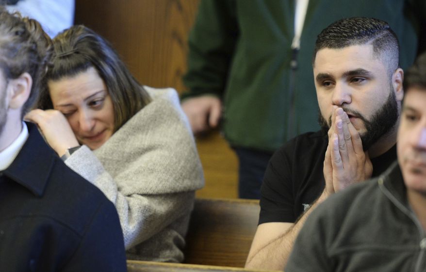 ADDS FIRST NAME OF VICTIM - Mohammedreza Sina Zangiband's sister, Soma Zangiband, left, and friend Marvin Abda, listen as Brian G. Brito, 21, of Manchester, N.H., is arraigned Thursday, March 30, 2017, in Lynn District Court in Lynn, Mass., and charged with murdering 24-year-old Mohammedreza Sina Zangiband. The driver for Atha's Famous Roast Beef was found shot multiple times inside his vehicle just before 6 p.m. Monday, March 27. (Paul Bilodeau/The Salem News via AP, Pool)