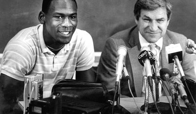 FILE - In this May 5, 1984, file photo, North Carolina guard Michael Jordan, left, and Tar Heels coach Dean Smith are shown at a news conference in Chapel Hill, N.C. (AP Photo, File)