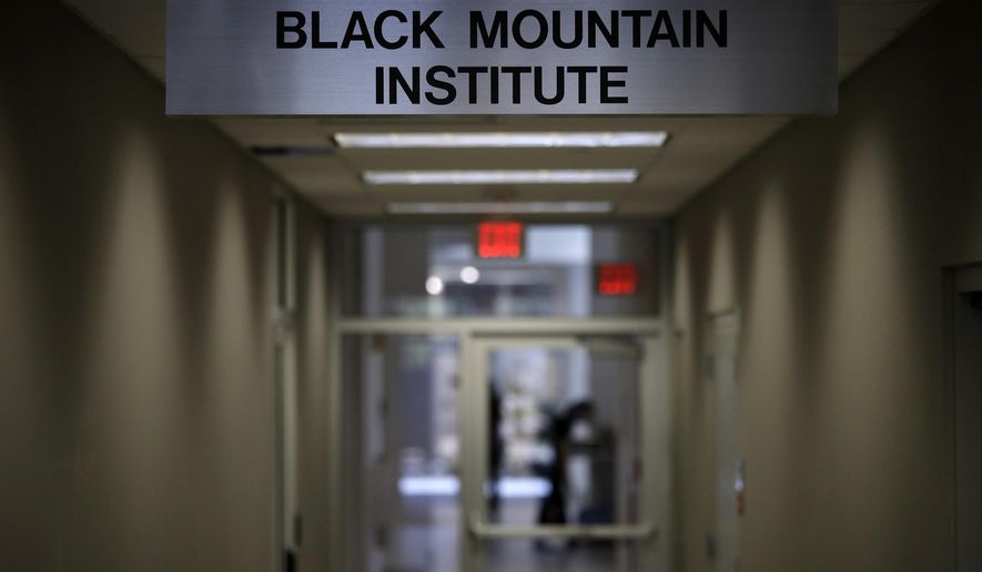 A sign for the Black Mountain Institute hangs in a hallway in a building at the University of Las Vegas, Nevada, Wednesday, March 29, 2017, in Las Vegas. The the Black Mountain Institute has purchased The Believer, a highly praised and proudly off-beat literary magazine founded in 2003. (AP Photo/John Locher)