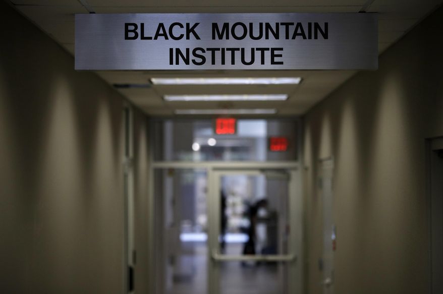 A sign for the Black Mountain Institute hangs in a hallway in a building at the University of Las Vegas, Nevada, Wednesday, March 29, 2017, in Las Vegas. The the Black Mountain Institute has purchased The Believer, a highly praised and proudly off-beat literary magazine founded in 2003. (AP Photo/John Locher)