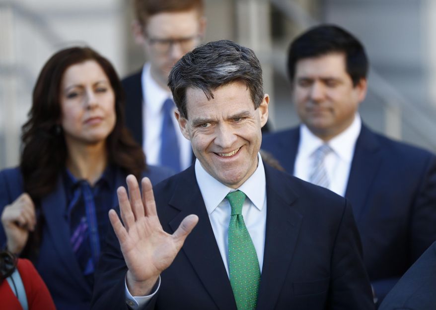 Bill Baroni waves to reporters after being sentenced in federal court in Newark, N.J., Wednesday, March 29, 2017. Baroni, 45, was sentenced to two years after he and Bridget Kellywere convicted for their roles in the 2013 George Washington Bridge lane-closing scandal. Kelly, 44, was sentenced to 18 months. Both must also serve 500 hours of community service. (AP Photo/Seth Wenig)