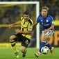FILE- In this Saturday, Oct. 29, 2016 file photo, Dortmund&#39;s Socratis, left, and Schalke&#39;s Max Meyer challenge for the ball during the German Bundesliga soccer match between Borussia Dortmund and FC Schalke 04 in Dortmund, Germany. Schalke can settle its angst over an inconsistent season so far with a win over Borussia Dortmund in the 172nd Ruhr derby on Saturday. (AP Photo/Martin Meissner, File)