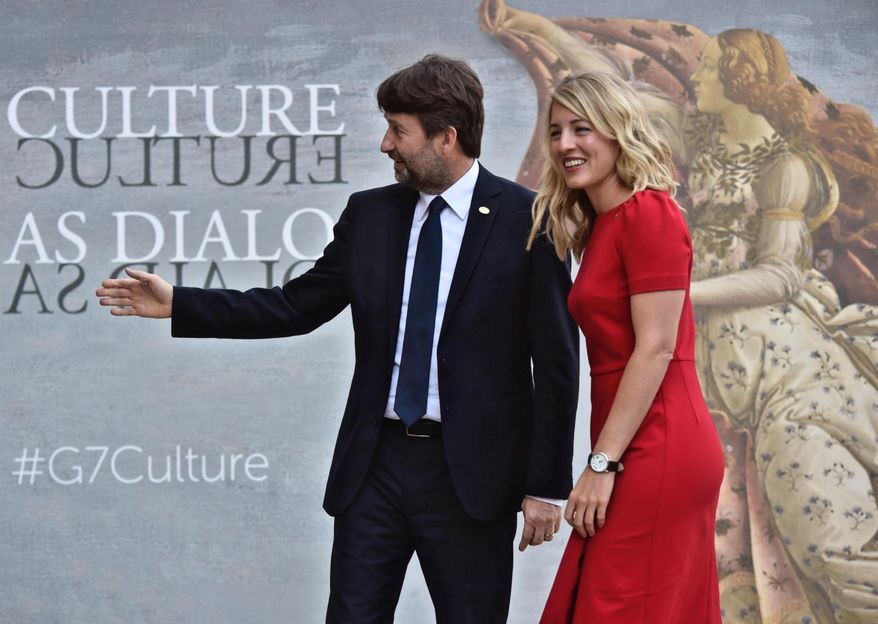 Canada's Culture Minister Melanie Joly, right, is welcomed by Italian Culture Minister Dario Franceschini as she arrives for a first-ever G7 Culture ministers meeting in Florence, Italy, March 30, 2017.  (Maurizio Degl' Innocenti/ANSA via AP)