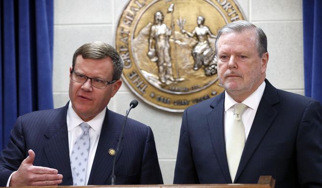 FILE - In this Tuesday, March 28, 2017 file photo, Republican leaders Rep. Tim Moore, left, and Sen. Phil Berger, hold a news conference in Raleigh, N.C. North Carolina Republican lawmakers said Wednesday night that they have an agreement with Democratic Gov. Roy Cooper on legislation to resolve a standoff over the state&#x27;s &amp;quot;bathroom bill.&amp;quot; Details about the replacement weren&#x27;t immediately available, Moore and Berger declined to take questions during a brief news conference. (Chris Seward/The News &amp;amp; Observer via AP, File)