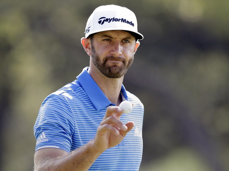 FILE - In this March 26, 2017, file photo, Dustin Johnson waves to the gallery after a birdie putt on the sixth hole during semifinal play at the Dell Technologies Match Play golf tournament at Austin County Club in Austin, Texas. (AP Photo/Eric Gay, File)