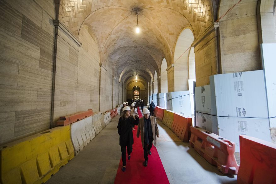 Architect Frank Gehry, center right, tours the vaulted walkway after a groundbreaking ceremony for planned renovations of the Philadelphia Museum of Art in Philadelphia, Thursday, March 30, 2017. (AP Photo/Matt Rourke)