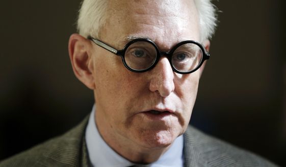 Roger Stone talks to reporters outside a courtroom in New York, Thursday, March 30, 2017. (AP Photo/Seth Wenig)