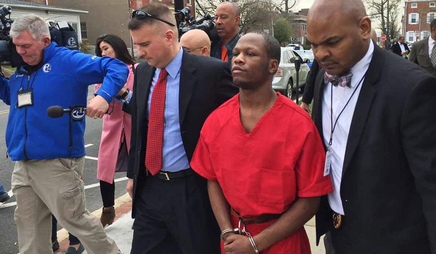 Dejohn Lee, accused of raping at least nine women, starting when he was 16, is escorted by police to an arraignment hearing in Media, Pa., Thursday, March 30, 2017. Delaware County District Attorney Jack Whelan on Monday said Lee has been in custody since early January, when one of his accusers saw him in a grocery store and called police. (Mari Schaefer/The Philadelphia Inquirer via AP)