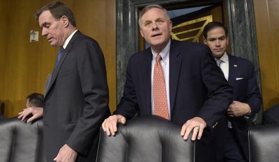 Senate Intelligence Committee Chairman. Sen. Richard Burr, R-N.C., center, Vice Chairman Sen. Mark Warner, D-Va., left, and Sen. Marco Rubio, R-Fla., right arrive for the Senate Intelligence Committee hearing on Capitol Hill in Washington, Thursday, March 30, 2017. Lawmakers heading the Senate Intelligence Committee focused squarely on Russia as they opened a hearing Thursday on attempts at undermining the 2016 U.S. presidential election. (AP Photo/Susan Walsh)