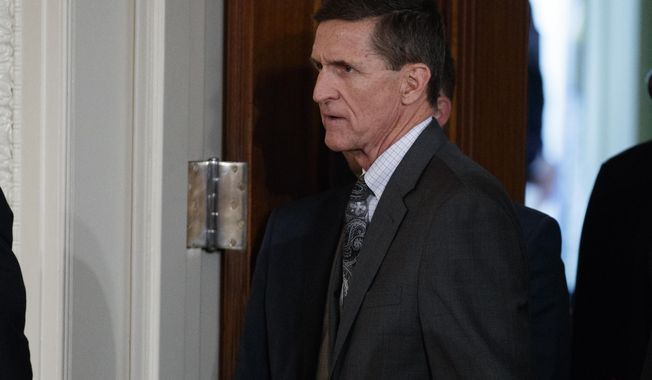 FILE - In this Feb. 13, 2017 file photo, Mike Flynn arrives for a news conference in the East Room of the White House in Washington. Flynn’s attorney says the former national security adviser is in discussions with the House and Senate intelligence committees on receiving immunity from “unfair prosecution” in exchange for questioning. Flynn attorney Robert Kelner says no “reasonable person” with legal counsel would answer questions without assurances. (AP Photo/Evan Vucci, File)