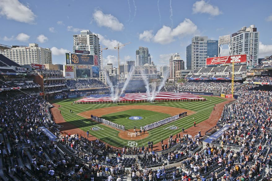 FILE - In this April 1, 2014, file photo, Opening Day celebrations take place at Petco Park before the San Diego Padres and Los Angeles Dodgers play a baseball game in San Diego. Over two-thirds of all major league teams now play in facilities that opened in 1992 or later, part of a ballpark boom that has changed how fans and players experience the game _ and has led to some contentious debate over how to pay for it all.  (AP Photo/Lenny Ignelzi, File)