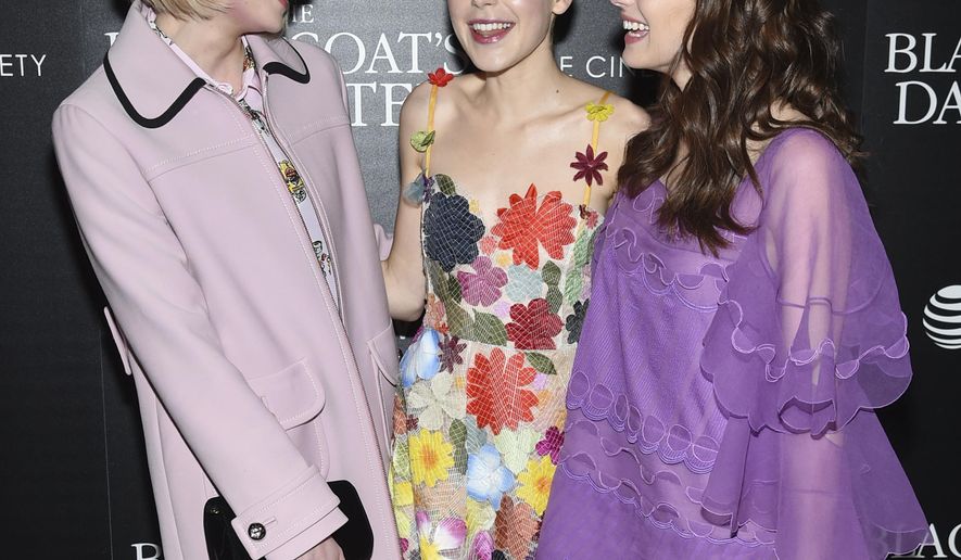 FILE - In this March 22, 2017 file photo, actors Lucy Boynton, left, Kiernan Shipka and Emma Roberts attend a special screening of "The Blackcoat's Daughter", hosted by A24 and DirecTV, at Landmark Sunshine Cinema in New York. Oz Perkins', whose father Anthony Perkins starred in "Psycho," is making his directorial debut this spring with the psychological thriller "The Blackcoat's Daughter." He said he was inspired by the strange glamour of the classic film “Rosemary’s Baby.”(Photo by Evan Agostini/Invision/AP)