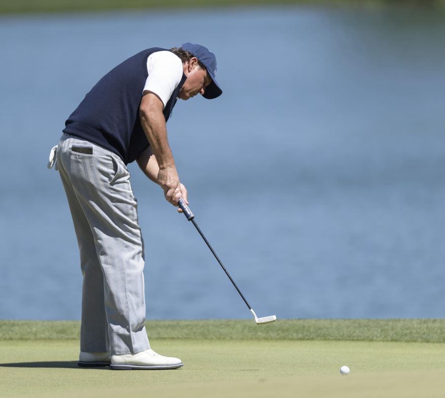 Phil Mickelson putting on the third green during the second round of the Shell Houston Open golf tournament Friday, March 31, 2017, at The Golf Club of Houston in Humble, Texas. (Wilf Thorne/Houston Chronicle via AP)