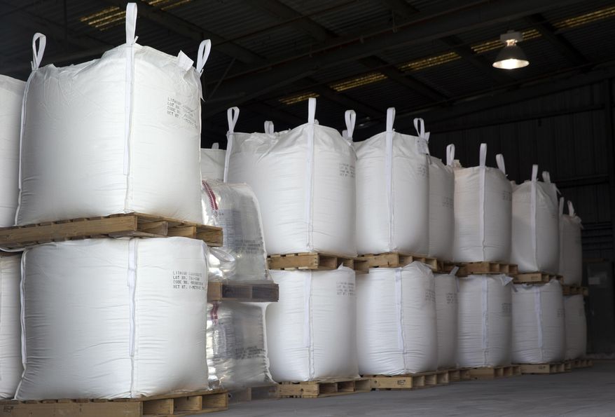 In this Monday, Jan. 30, 2017 photo, lithium carbonate is ready for shipping in a Silver Peak lithium mine warehouse near Tonopah, Nev. Each sack contains 500 kilograms of lithium carbonate. (Steve Marcus /Las Vegas Sun via AP)