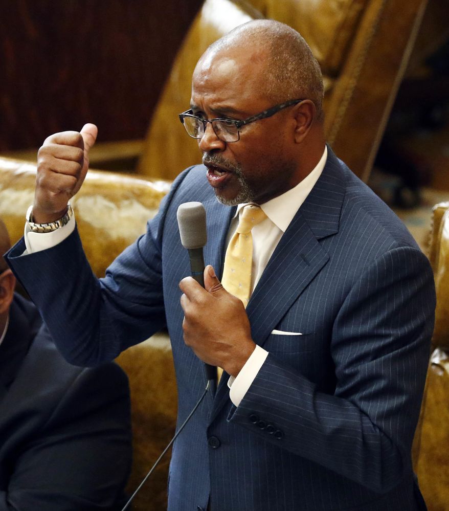 Rep. Robert Johnson, D-Natchez, questions Rep. Joey Hood, R-Ackerman, unseen, about his presentation of a bill that would restore a privatized Medicaid service program in light of the state's current fiscal situation that might require layoffs of state employees, Tuesday, March 28, 2017, at the Capitol in Jackson, Miss. Lawmakers continue to argue about the unfinished pieces of the state budget for the 2018 fiscal year that begins July 1. (AP Photo/Rogelio V. Solis)