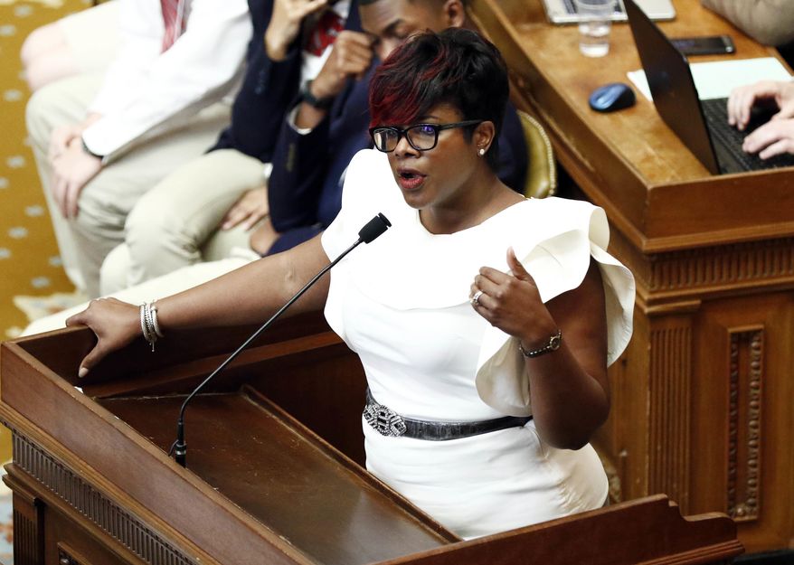 Rep. Adrienne Wooten, D-Jackson, speaks against consideration of a bill that would restore a privatized Medicaid service program in light of the state's current fiscal situation that might require layoffs of state employees, Tuesday, March 28, 2017, at the Capitol in Jackson, Miss. Lawmakers continue to argue about the unfinished pieces of the state budget for the 2018 fiscal year that begins July 1. (AP Photo/Rogelio V. Solis)