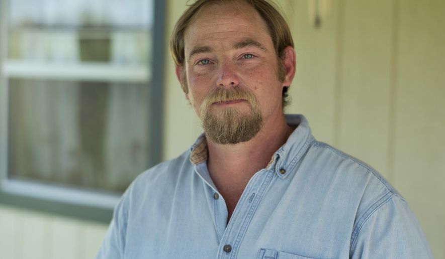 Eric Wilson poses for a portrait, Wednesday, March 29, 2017, at his home in Jourdanton, Texas. Wilson is one of four men known as the "Norfolk Four," who have long claimed police bullied them into falsely confessing to the 1997 rape and murder of Michelle Moore-Bosko in Norfolk, Va. Wilson was recently pardoned by Virginia Gov. Terry McAuliffe, ending a decades-long fight to clear his name. A pardon was the only recourse for Wilson, whose attempts to get his rape conviction thrown out in court had failed because of a technicality. (AP Photo/Darren Abate)