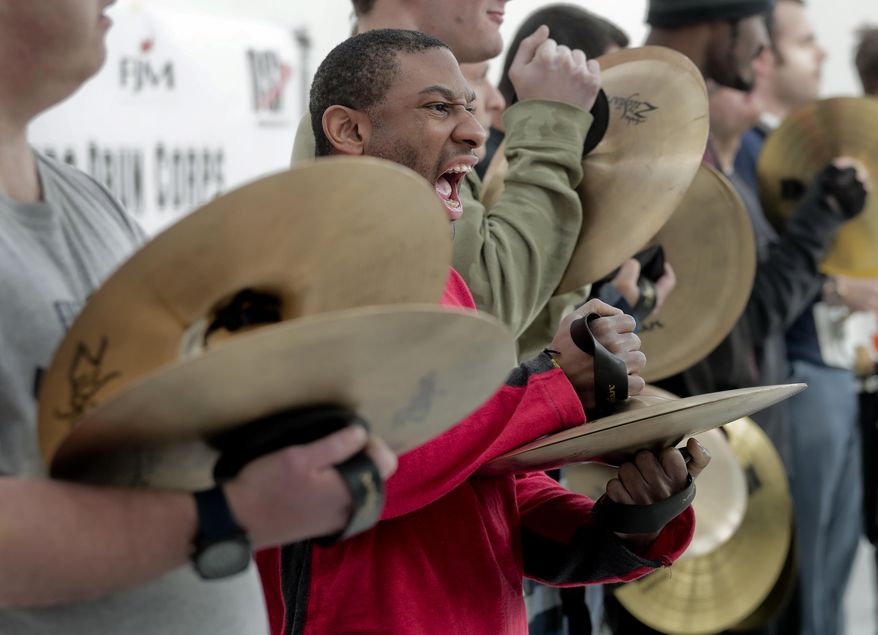 In this March 22, 2017, photo, members of the FREE Players Drum Corps rehearse a routine in Old Bethpage, N.Y. The 65-member band is composed entirely of adults with intellectual and physical disabilities. They've performed at Disney World and marched in New York City's Columbus Day Parade. Now they’ve been invited to play an exhibition at the 2018 world championships in Indianapolis. (AP Photo/Julie Jacobson)