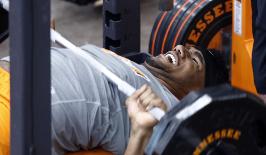 Derek Barnett bench presses during Tennessee NFL Pro Day on Friday, March 31, 2017, in Knoxville, Tenn. (AP Photo/Wade Payne)