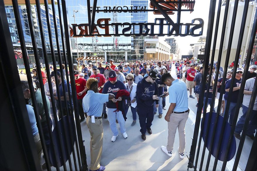 Atlanta Braves Braves and Nw York Yankees fans enter SunTrust Park for the first time for an exhibition baseball game and the soft opening of SunTrust Park on Friday, March 31, 2017, in Atlanta. (Curtis Compton/Atlanta Journal-Constitution via AP)