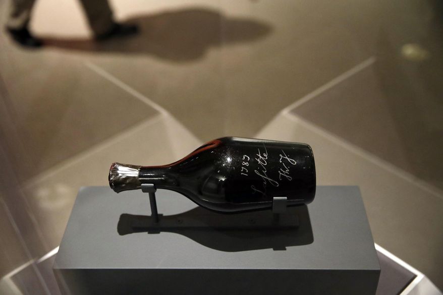 In this March 29, 2017 photo, a bottle of wine purported to have belonged to Thomas Jefferson is seen on display during a press preview of &amp;quot;Treasures on Trial: The Art and Science of Detecting Fakes&amp;quot; at the Winterthur Museum in Wilmington, Del. Deemed a fake, the owner claimed that the bottle was found behind the brick wall of a house in Paris, where Jefferson lived between 1784 and 1798. But Jefferson never lived in the neighborhood where the bottle was purported to have been found. (AP Photo/Patrick Semansky)