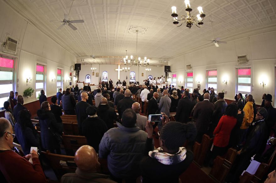 People attend the funeral services for Timothy Caughman Saturday, April 1, 2017, in New York. Caughman was alone and collecting bottles for recycling last month when he was attacked from behind with a sword. Authorities say his assailant, James Harris Jackson, took a bus last month to New York to target black men. Jackson is being held without bail on charges of murder as a hate crime. (AP Photo/Frank Franklin II)