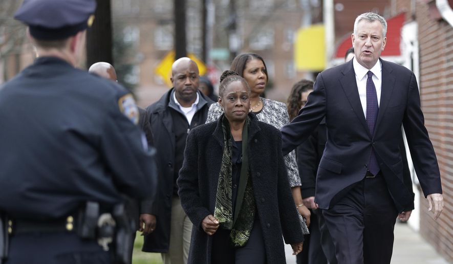 New York City Mayor Bill de Blasio, right, his wife, Chirlane McCray , left, and Public Advocate Letitia James, arrive for the funeral services for Timothy Caughman Saturday, April 1, 2017, in New York.  Caughman was alone and collecting bottles for recycling last month when he was attacked from behind with a sword.  Authorities say his assailant, James Harris Jackson, took a bus last month to New York to target black men.  Jackson is being held without bail on charges of murder as a hate crime.   (AP Photo/Frank Franklin II)