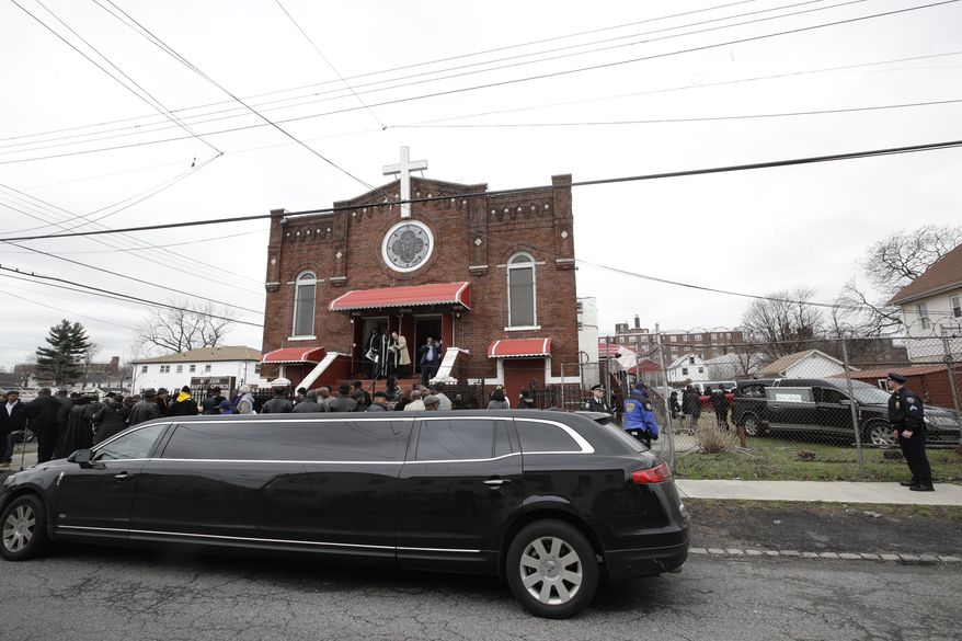 People attend the funeral services for Timothy Caughman Saturday, April 1, 2017, in New York. Caughman was alone and collecting bottles for recycling last month when he was attacked from behind with a sword. Authorities say his assailant, James Harris Jackson, took a bus last month to New York to target black men. Jackson is being held without bail on charges of murder as a hate crime. (AP Photo/Frank Franklin II)